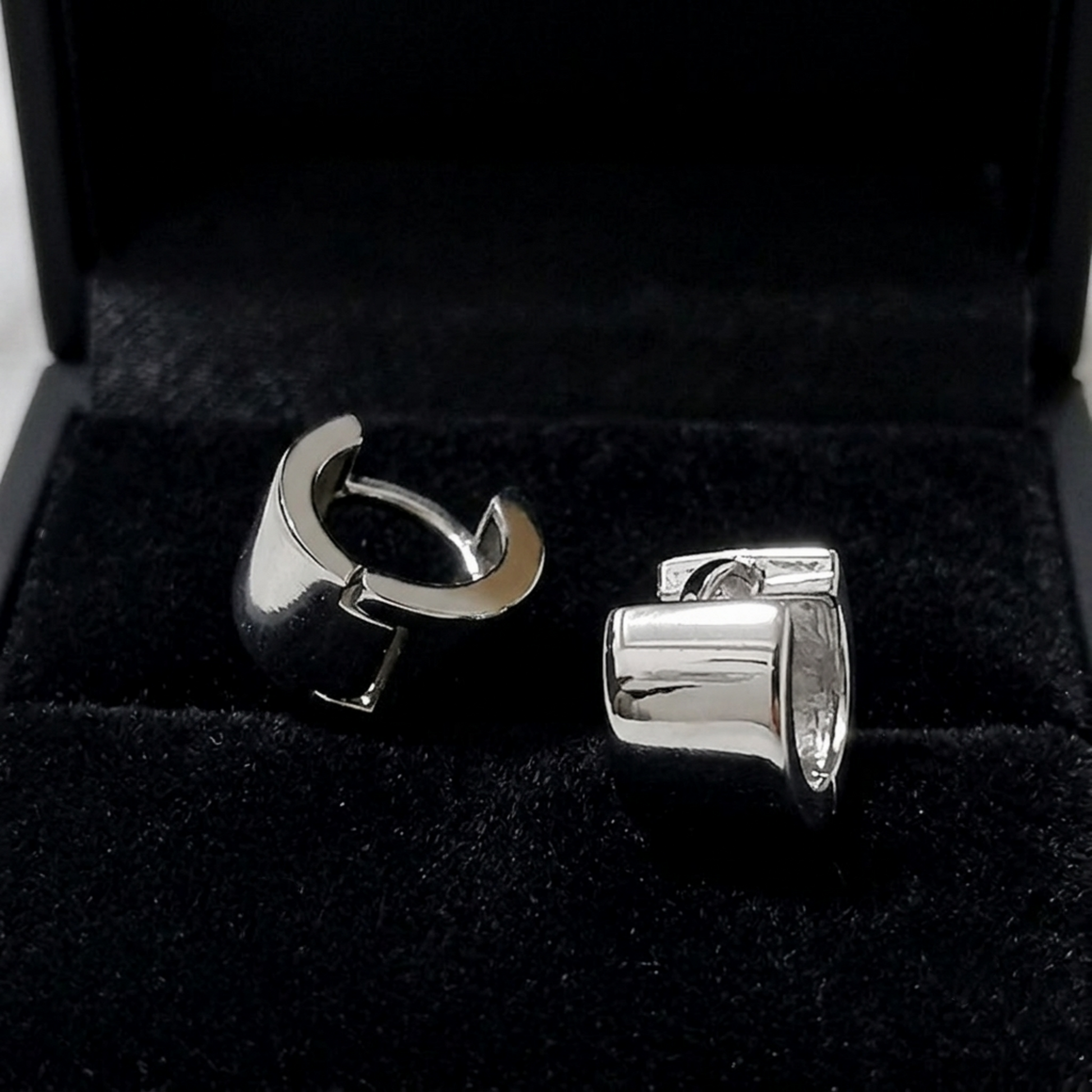 Rhodium 4.5mm sterling silver hoop earrings with hinged clasp, pair shown.