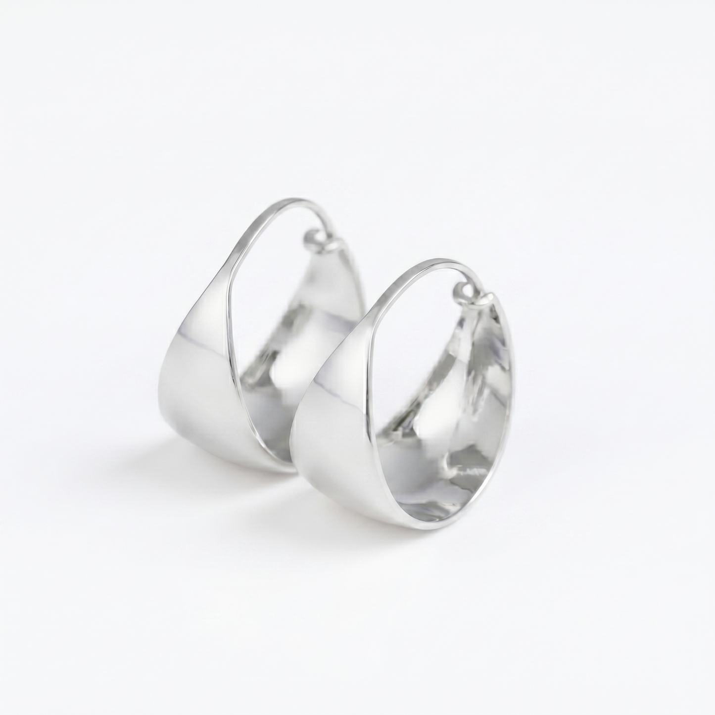Silver wide dome huggie hoop earrings with hinge clasp and polished curved face