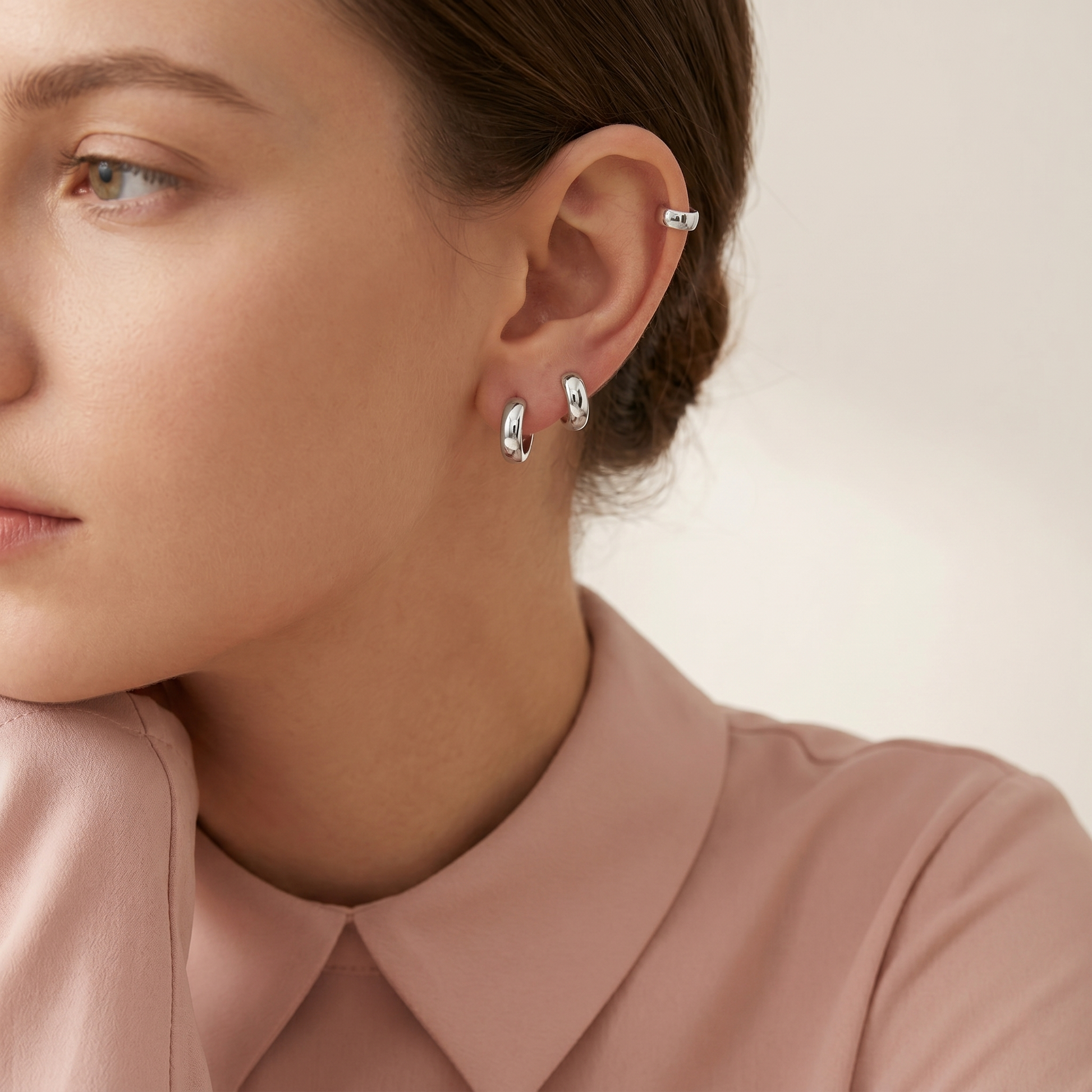 Rhodium-tone 3mm sleeper huggie earrings on model ear