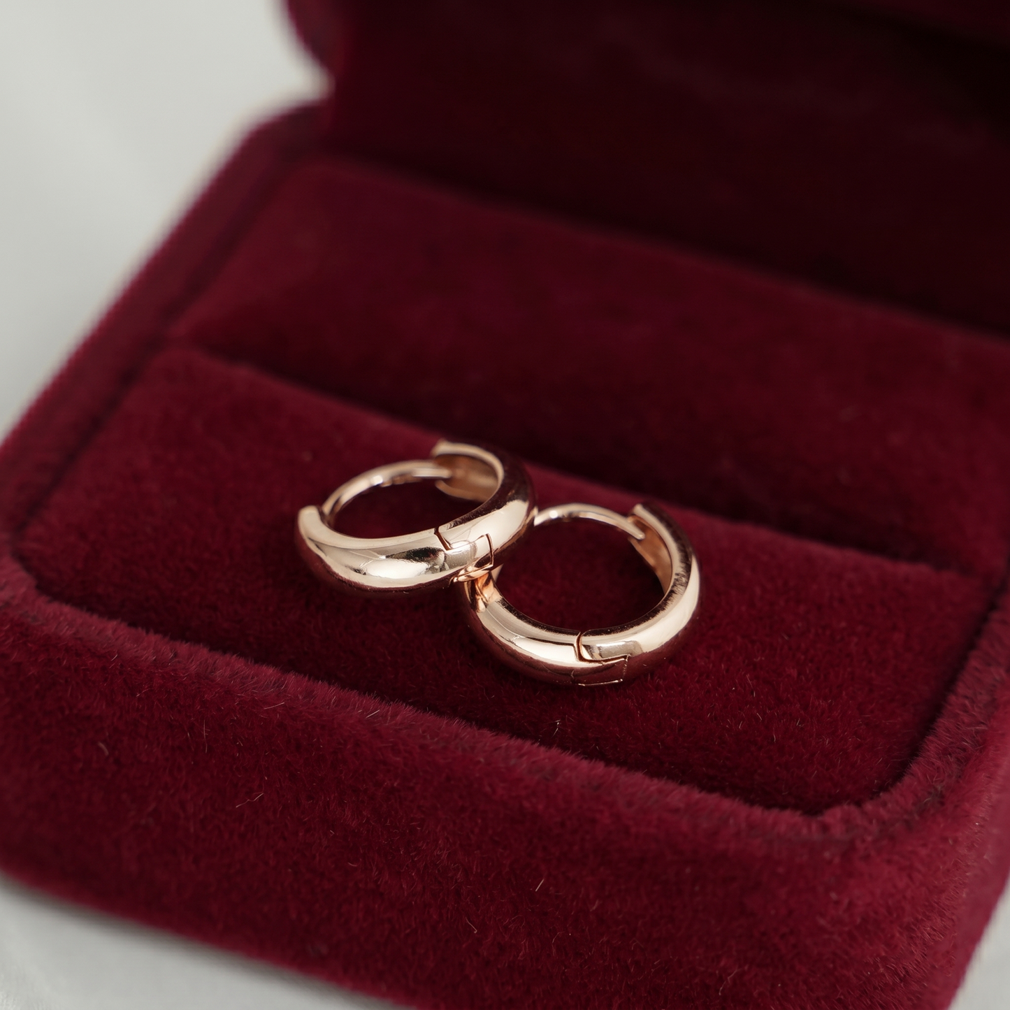 Rose gold 3mm sleeper huggie hoops with smooth rounded front