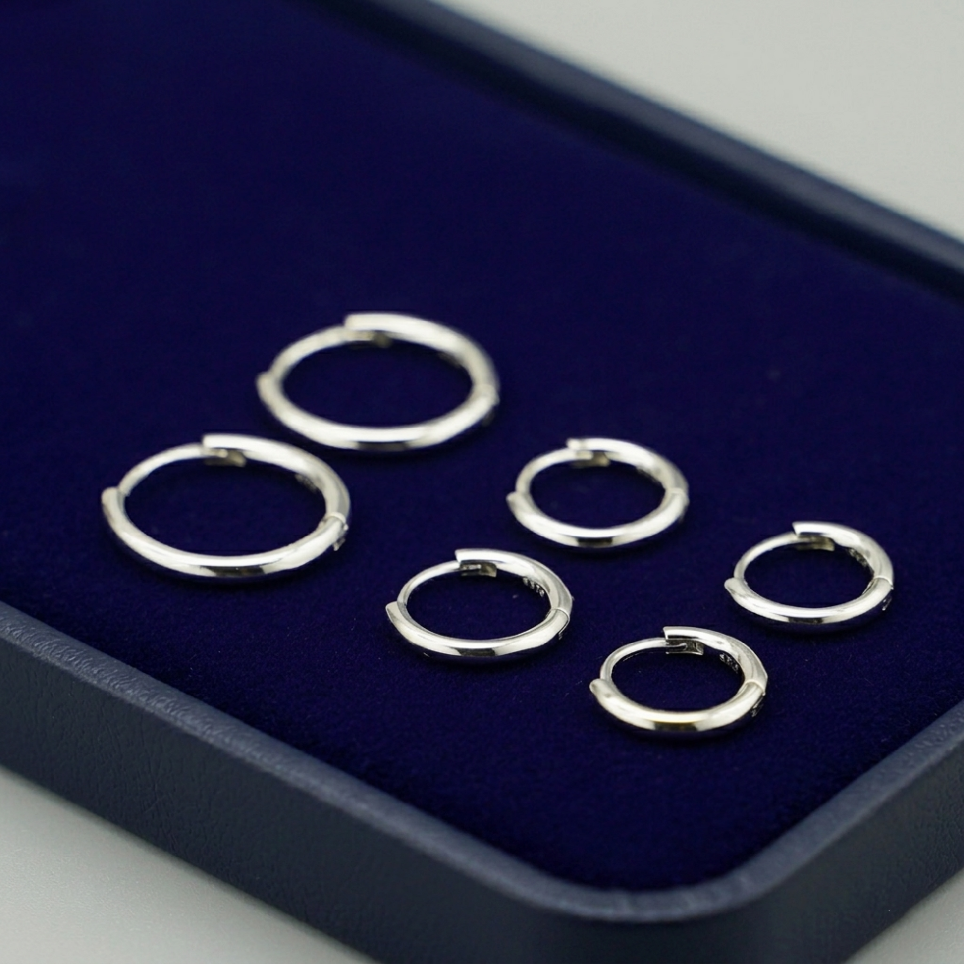 Rhodium 2mm sleeper huggies, small round hoop earrings