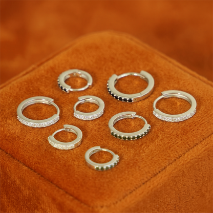Assorted mini hoops in silver-tone with clear stones and black bead accents