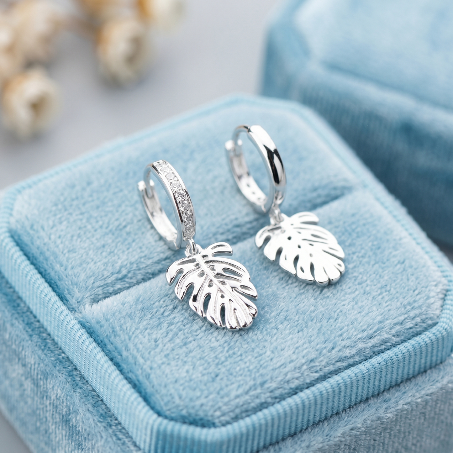 Monstera Leaf Drop Huggies earrings, silver-tone hoops with leaf-shaped dangling charms