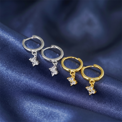 Flower Charm Huggies display: silver and gold huggie hoops with flower drop charms