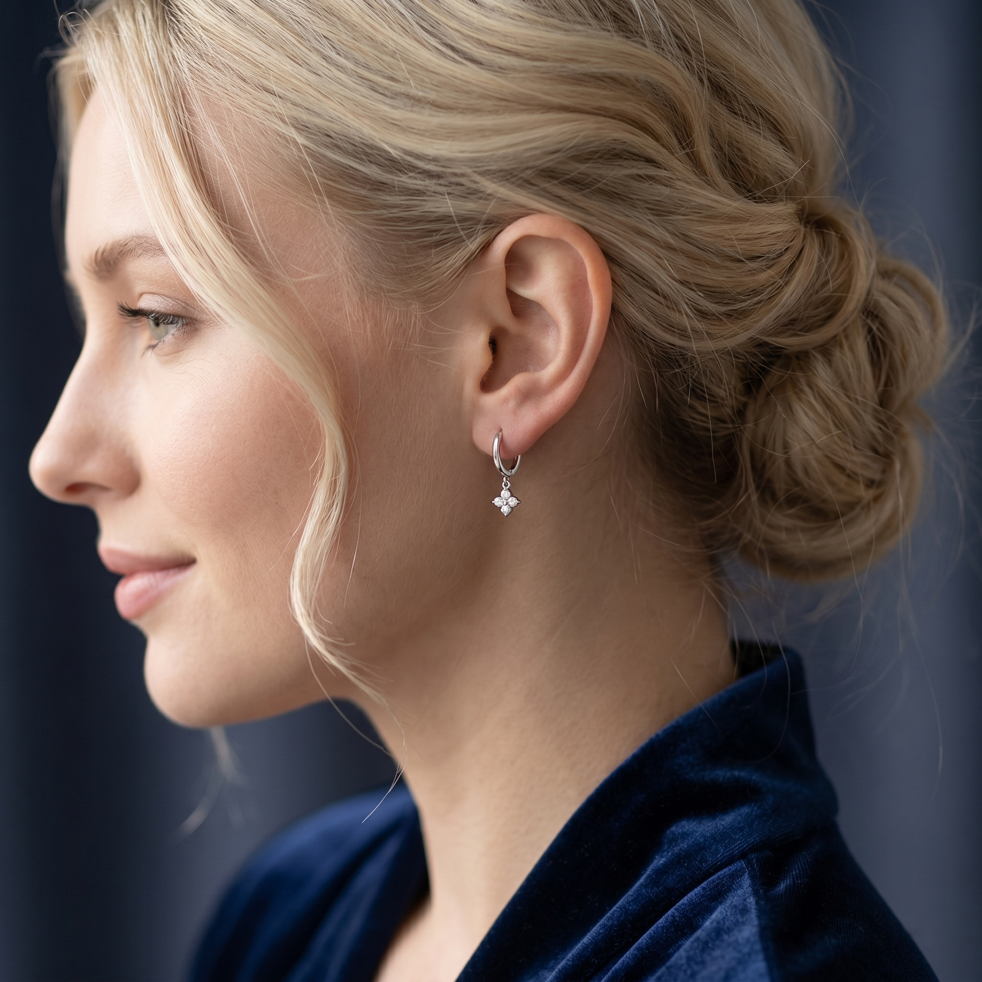 Flower Charm Huggies, rhodium: crystal flower charm hoop earrings on model