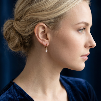 Flower Charm Huggies, 18K gold: crystal flower charm hoop earrings on model