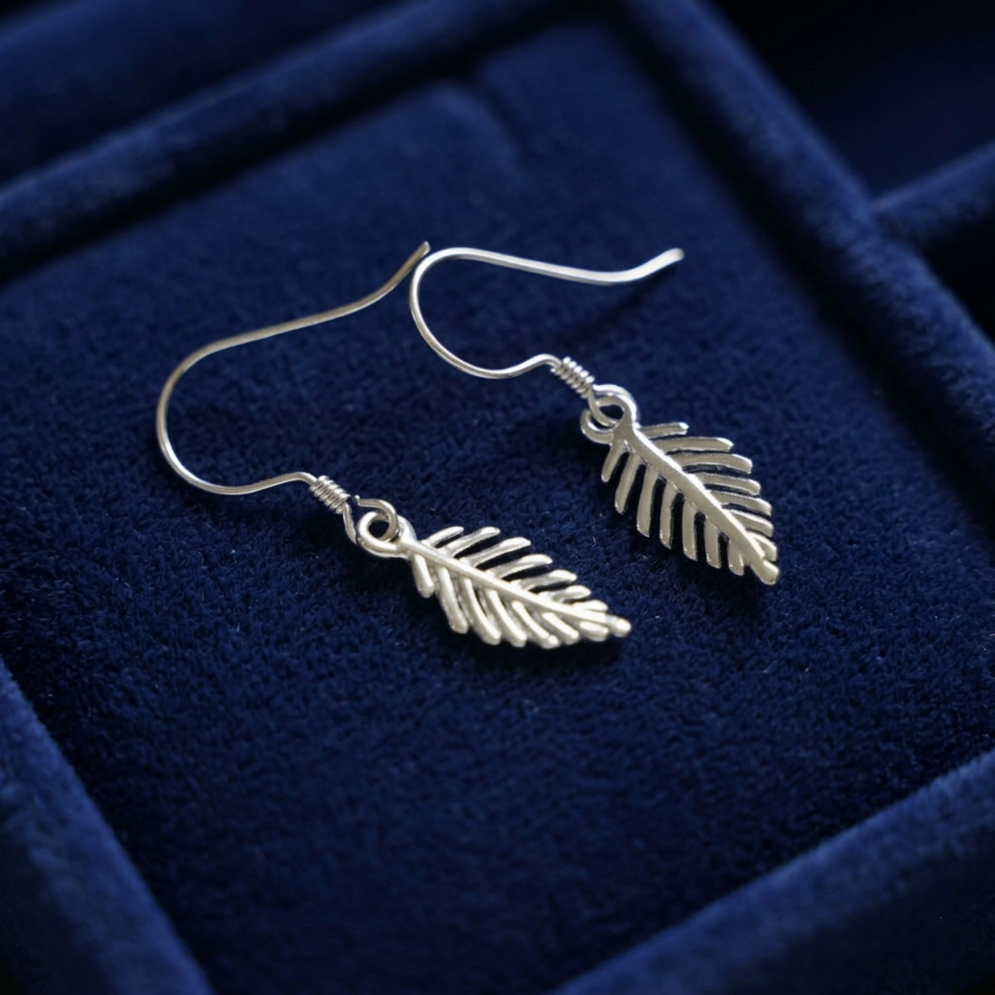 Leaf drop hook earrings with two dangling leaf charms, silver tone