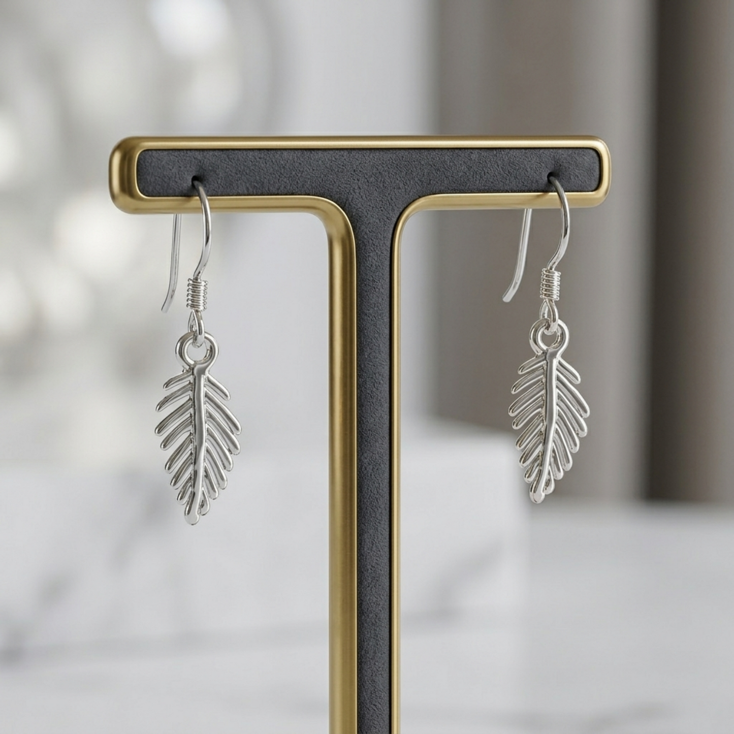 Leaf drop hook earrings with dangling leaf charms, silver tone