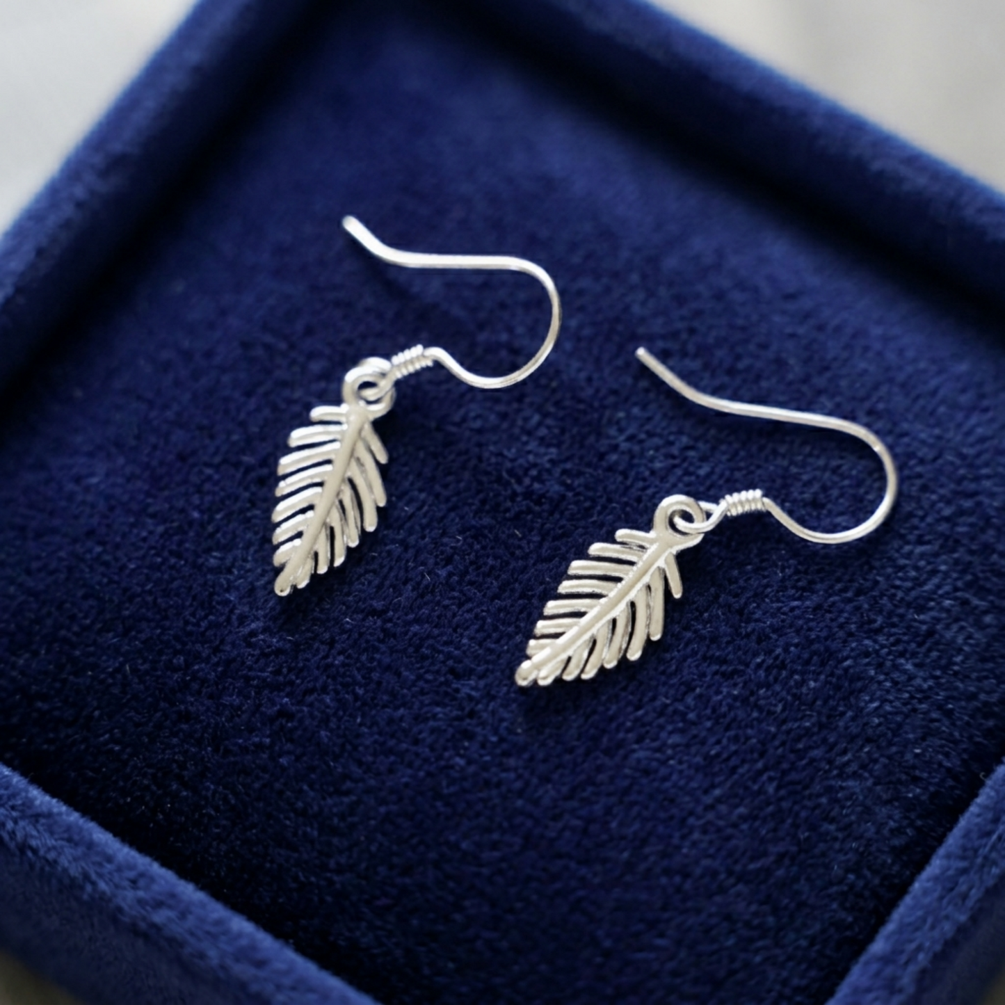 Leaf drop hook earrings with dangling leaf charms, silver tone