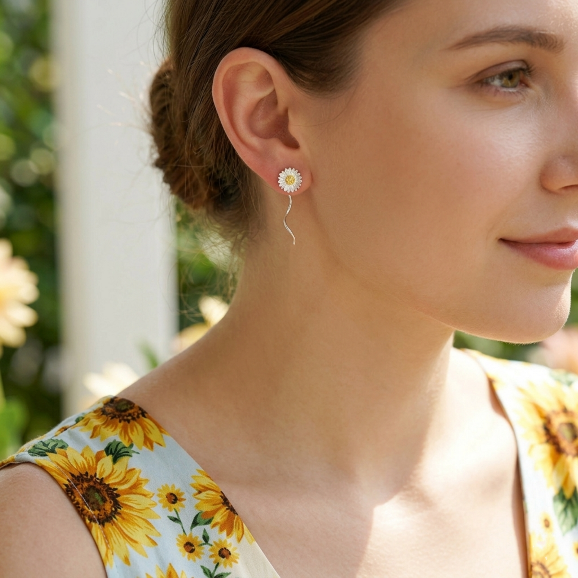 Sunflower threader earrings on ear, silver flower with yellow center and thin dangling chain