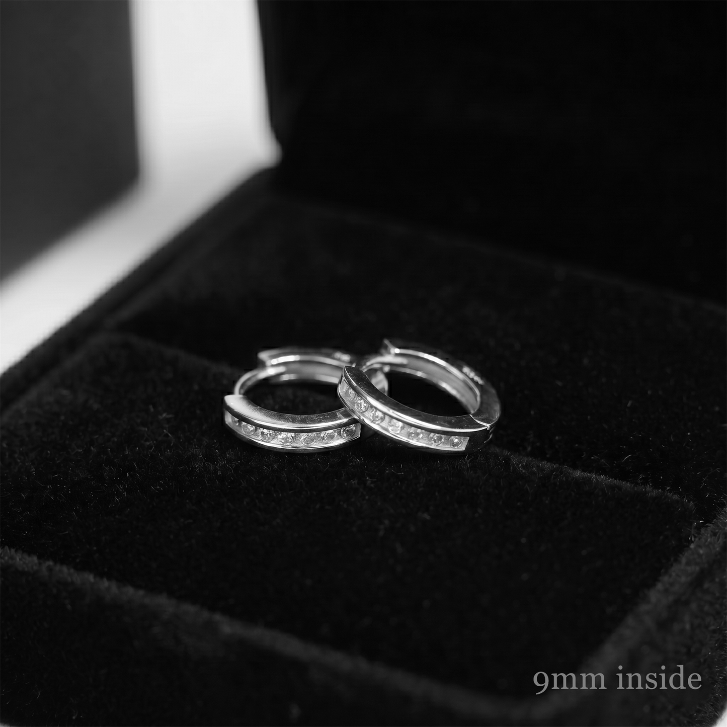 Channel Huggie Hoops in Rhodium—small hinged hoops with inset stones
