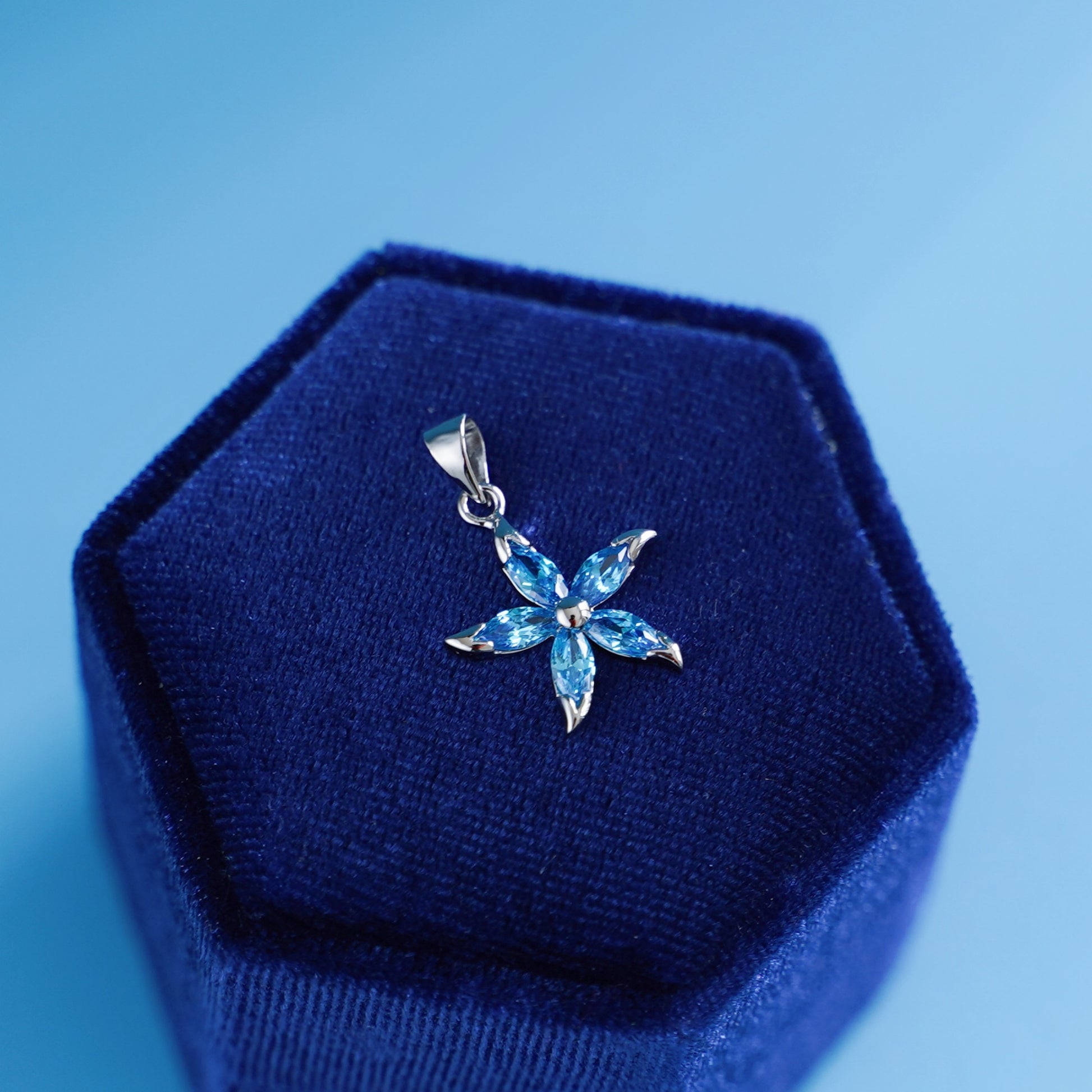 925 Sterling Silver Flower Pendant with Light Blue Sapphire CZ - sugarkittenlondon
