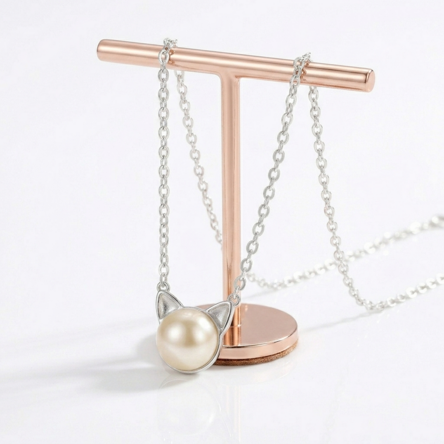 Cat pearl jewelry set with rose gold-tone chain necklace and matching cat-face stud earrings