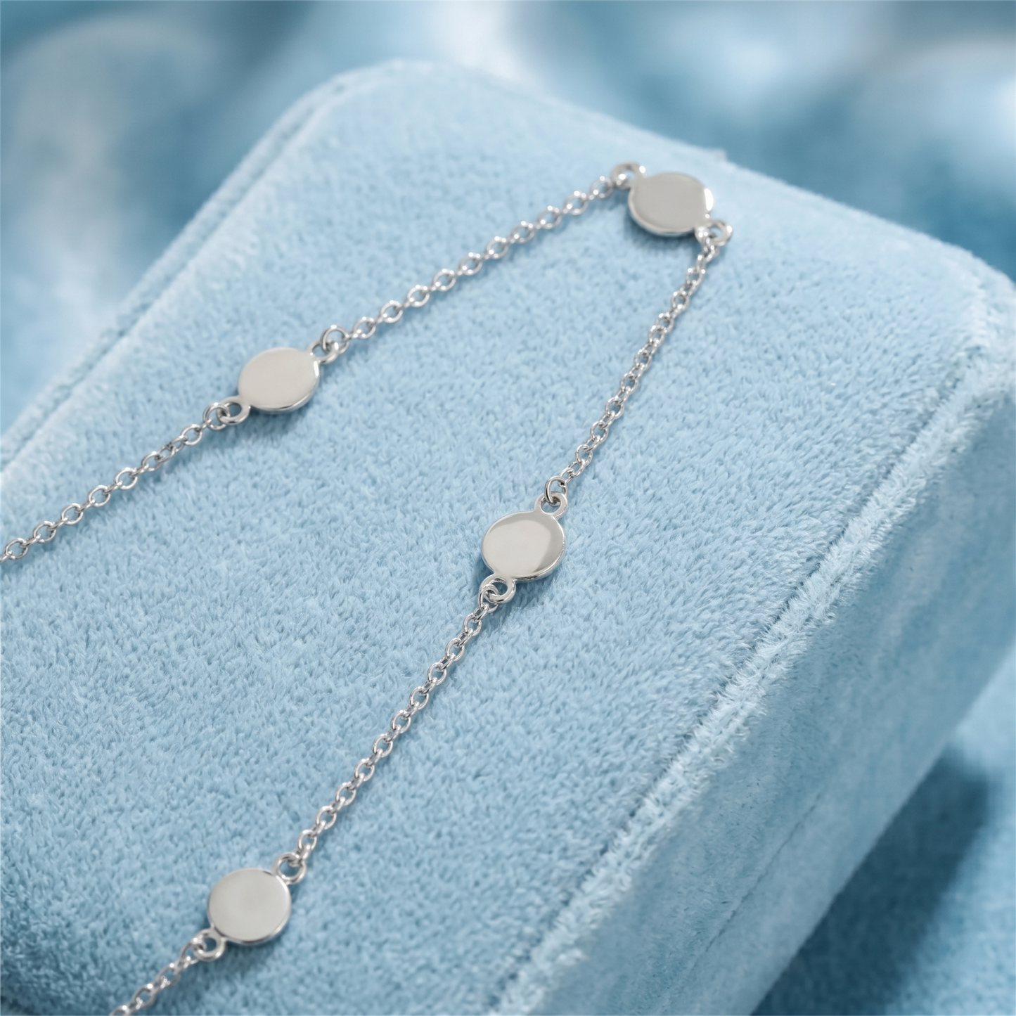 Multi-disc choker with round disc charms and short chain links, side view