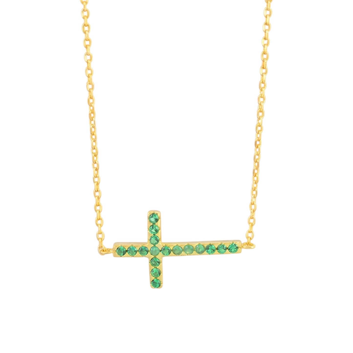 Sideways cross CZ necklace with green stones on a gold-tone chain