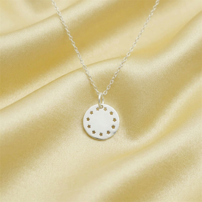 Shiny Disc Star Charm round silver pendant with star pattern on a silver chain