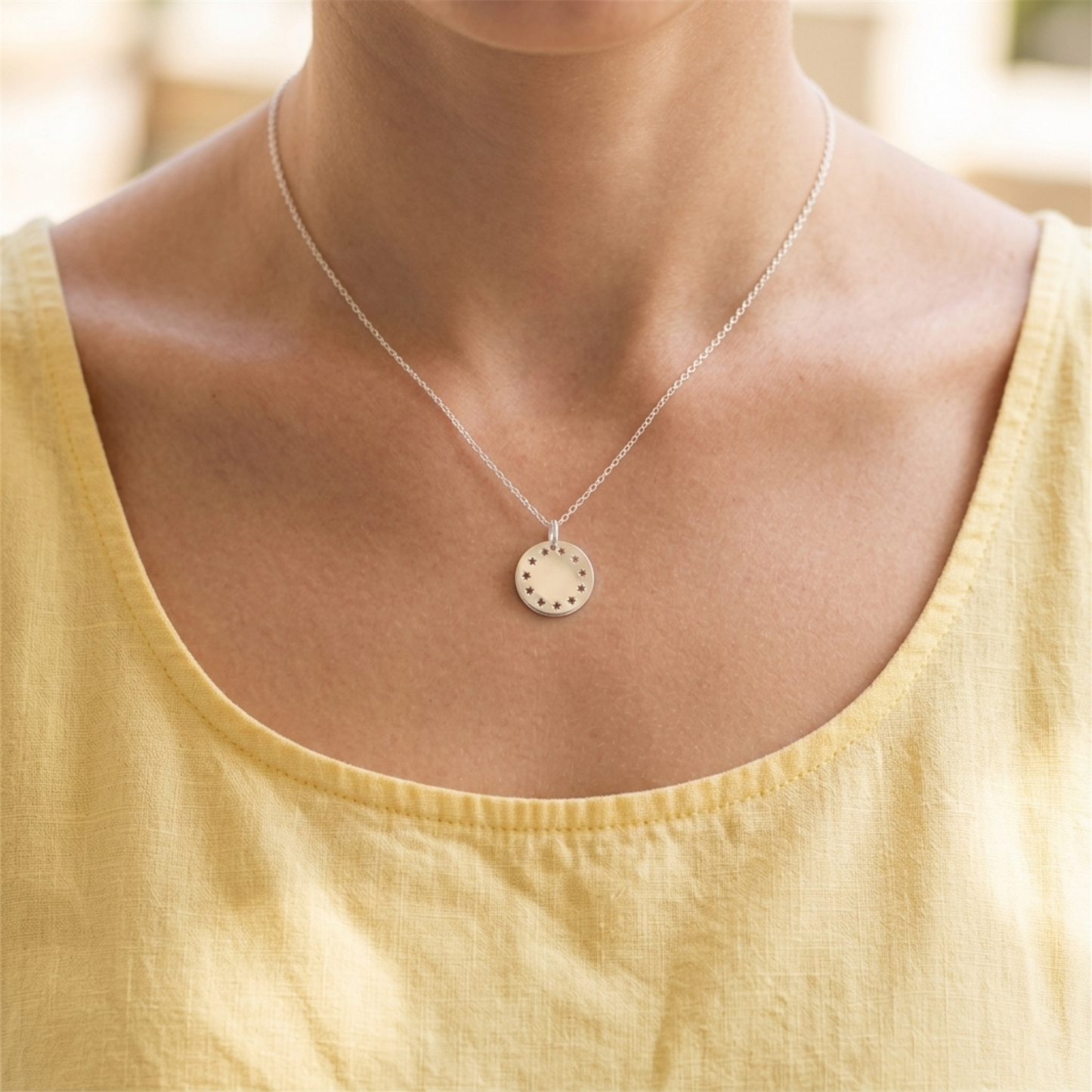Shiny Disc Star Charm necklace with round silver pendant disc featuring star details