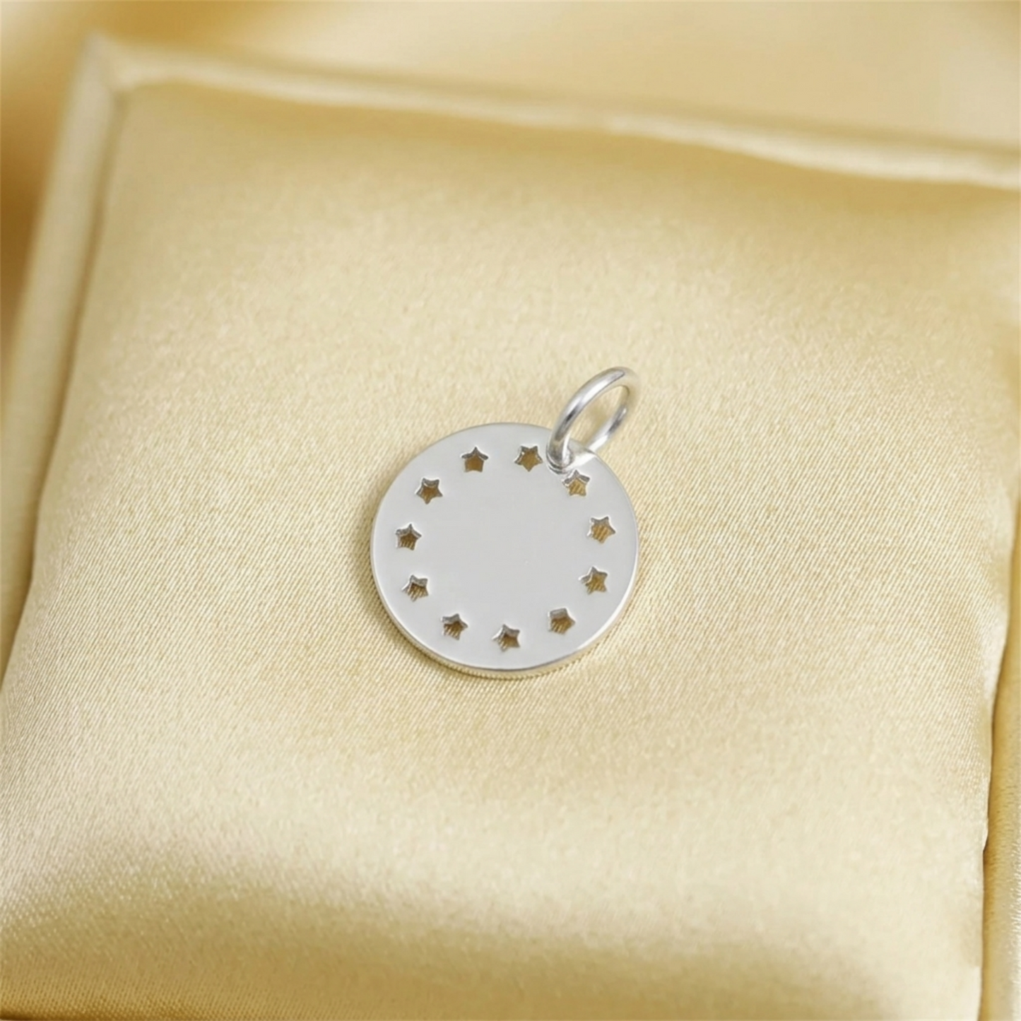 Shiny Disc Star Charm silver round pendant with star accents and top loop