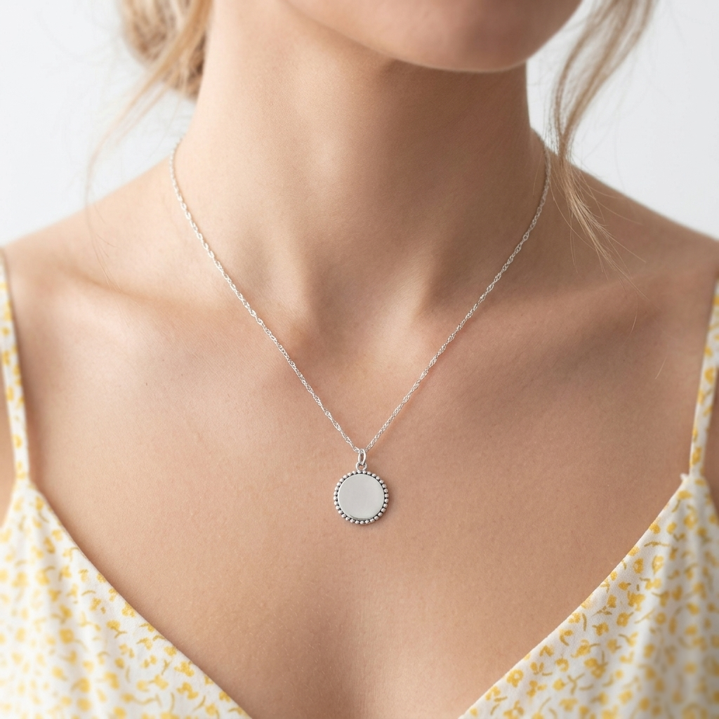 Round oxidised beaded circle charm pendant on chain, silver-tone bead rim