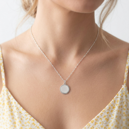 Round oxidised beaded circle charm pendant on chain, silver-tone bead rim