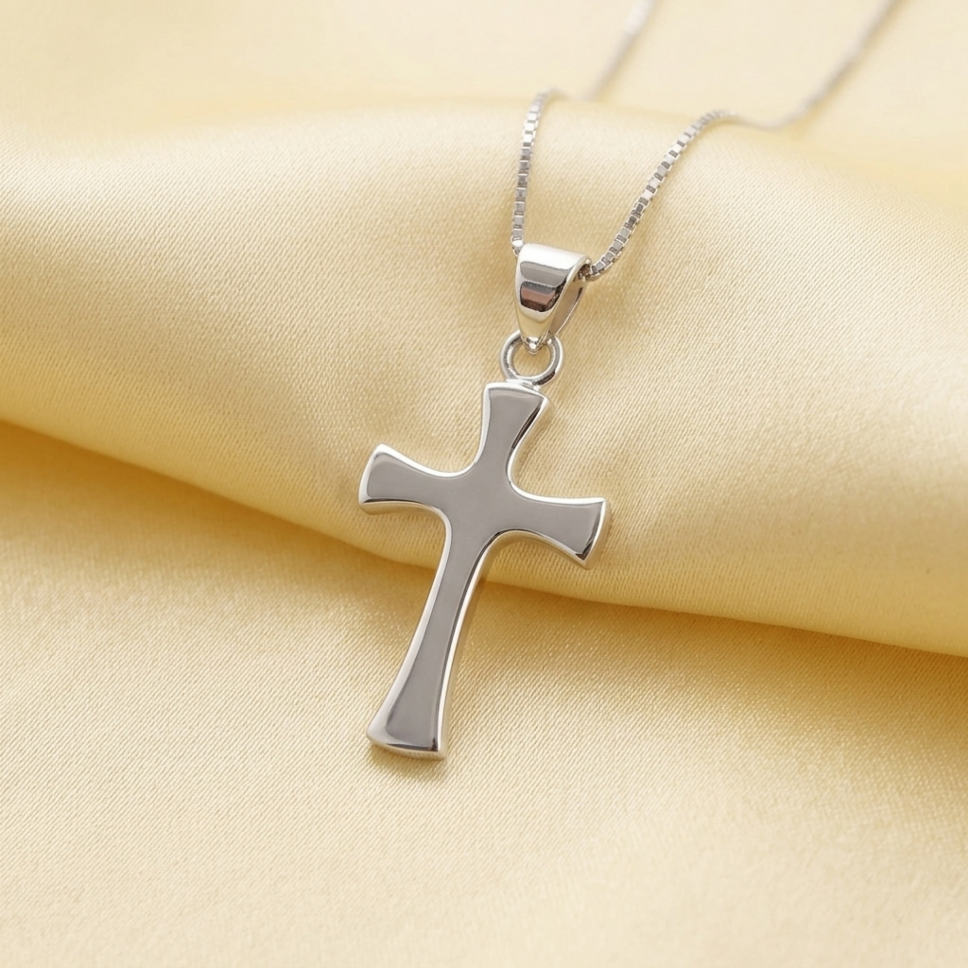 Polished flared cross pendant on chain, silver-tone cross with shine finish