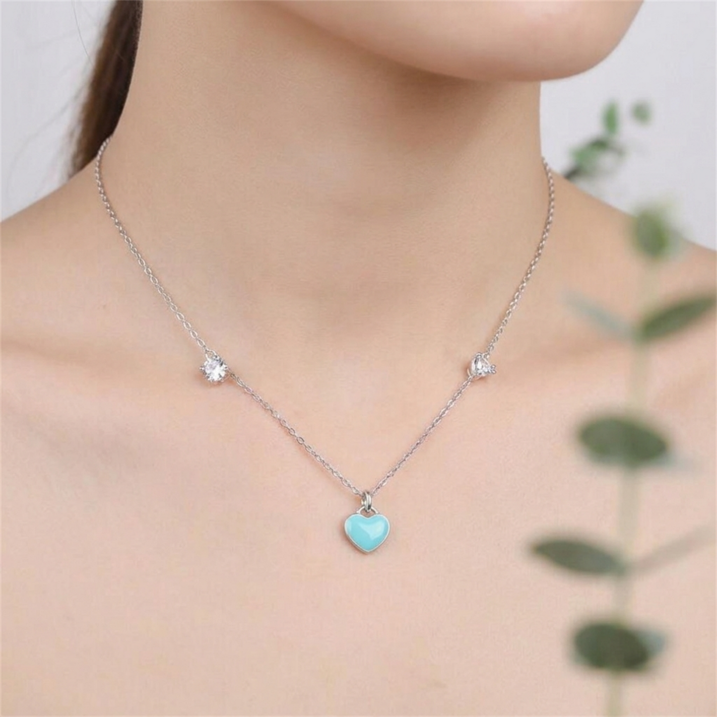 Turquoise puffy heart pendant on a silver necklace chain