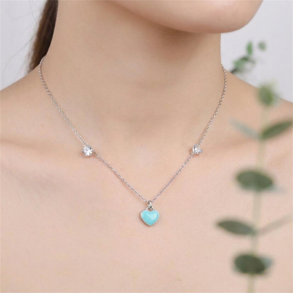 Turquoise puffy heart pendant on a silver necklace chain