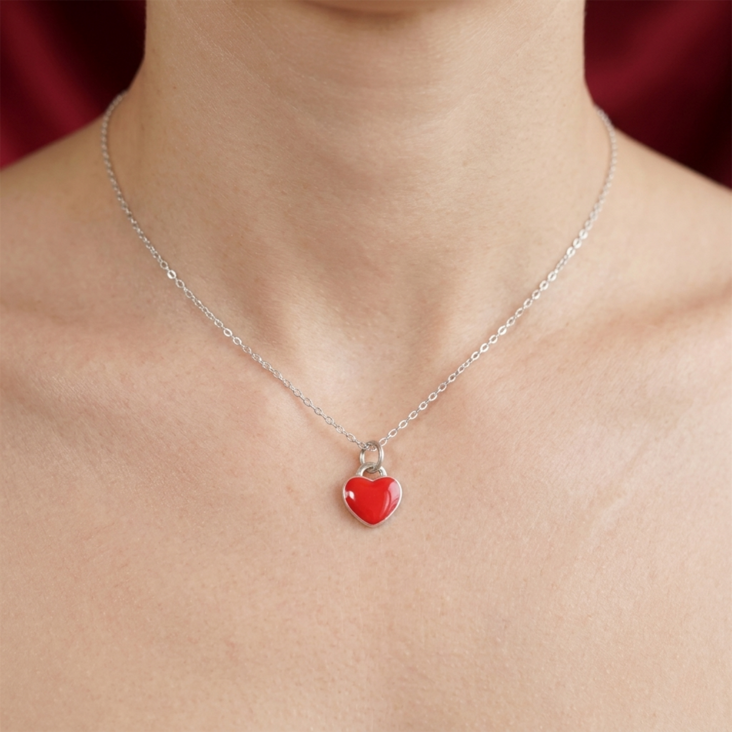 Heart charm necklace with red glossy enamel heart and silver clasp