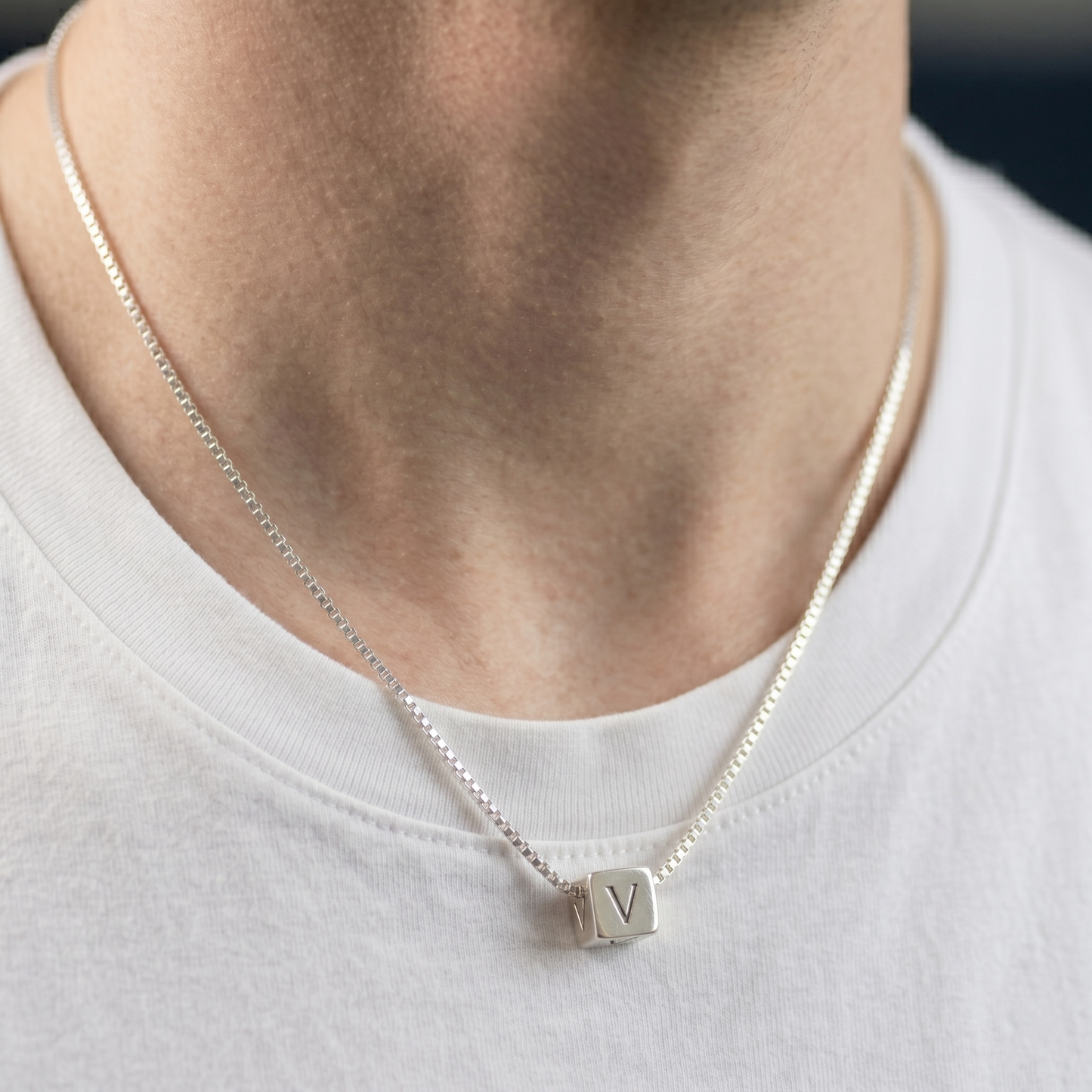 Alphabet cube bead necklace with a V letter pendant on a silver chain
