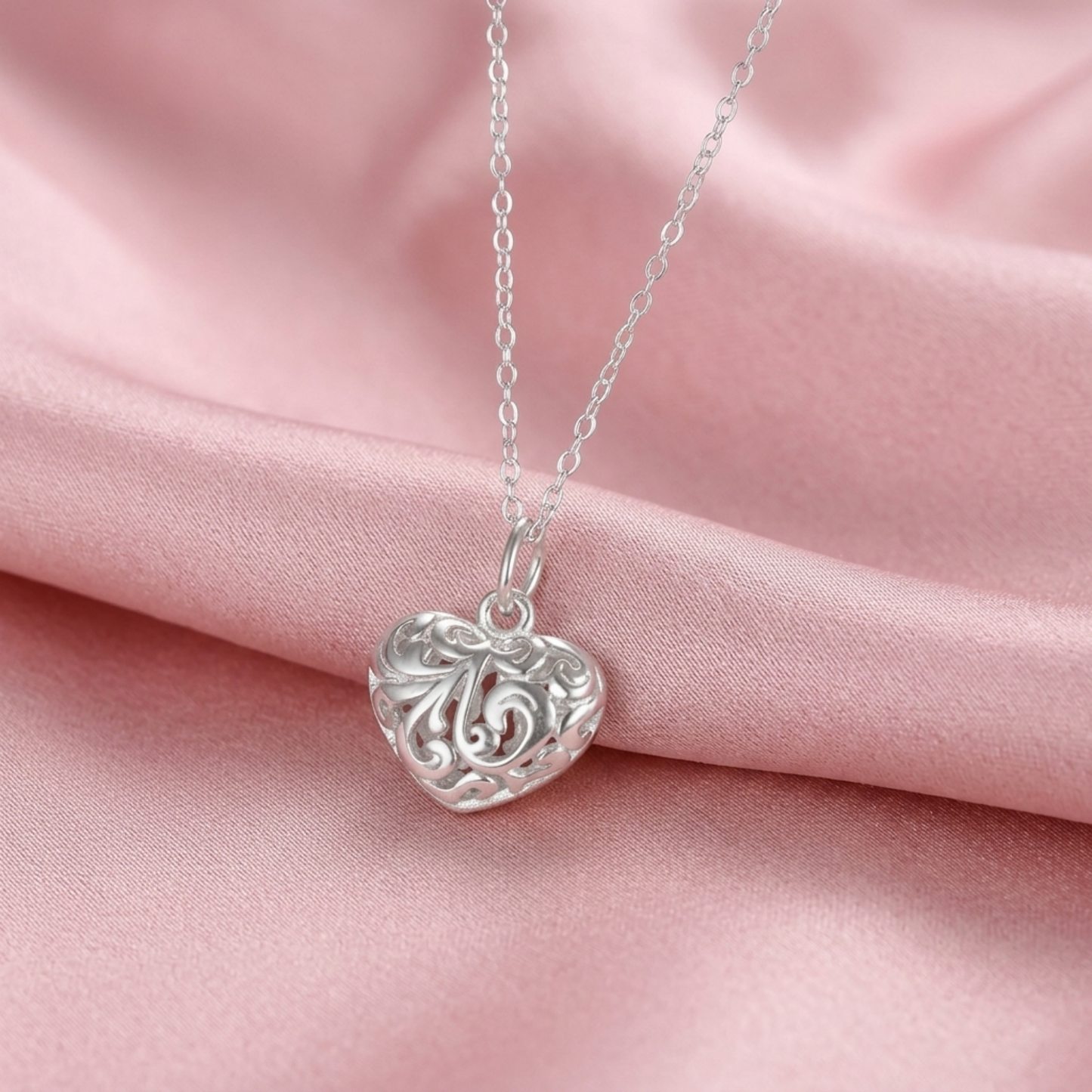 Silver-tone filigree puffy heart pendant on chain