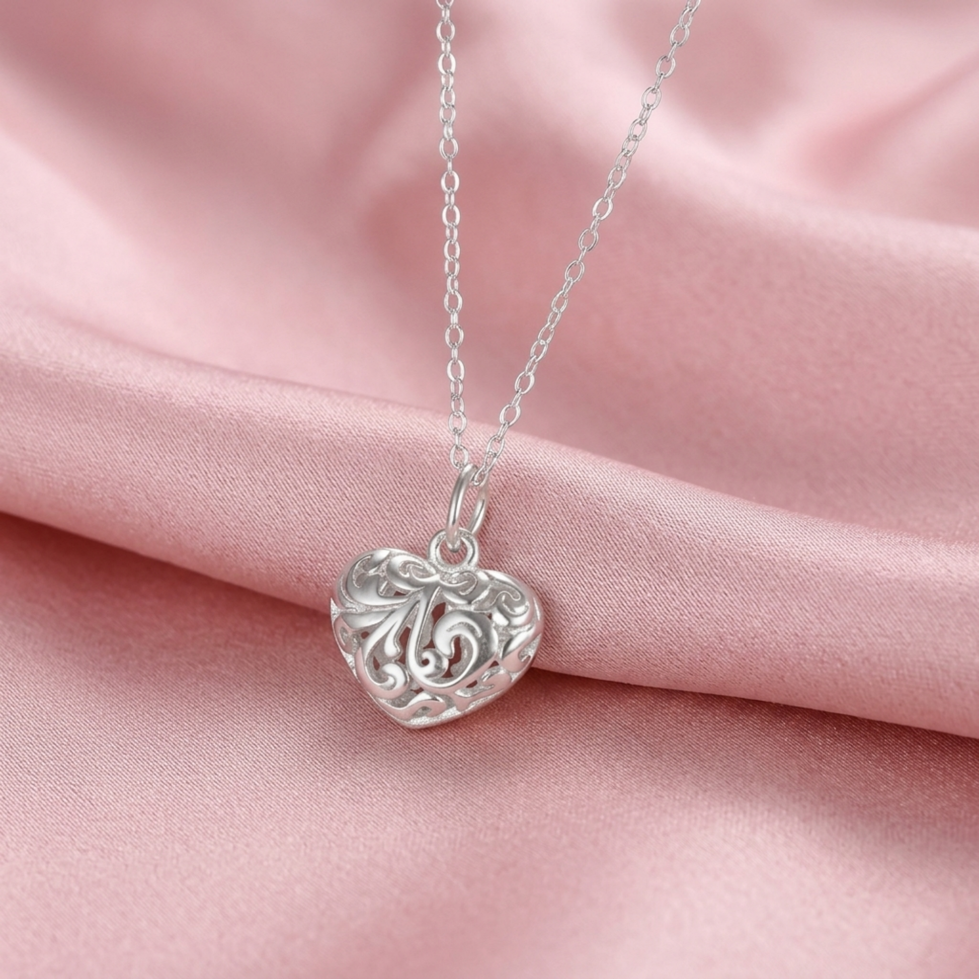 Silver-tone filigree puffy heart pendant on chain