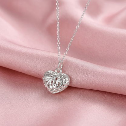 Silver-tone filigree puffy heart pendant on chain