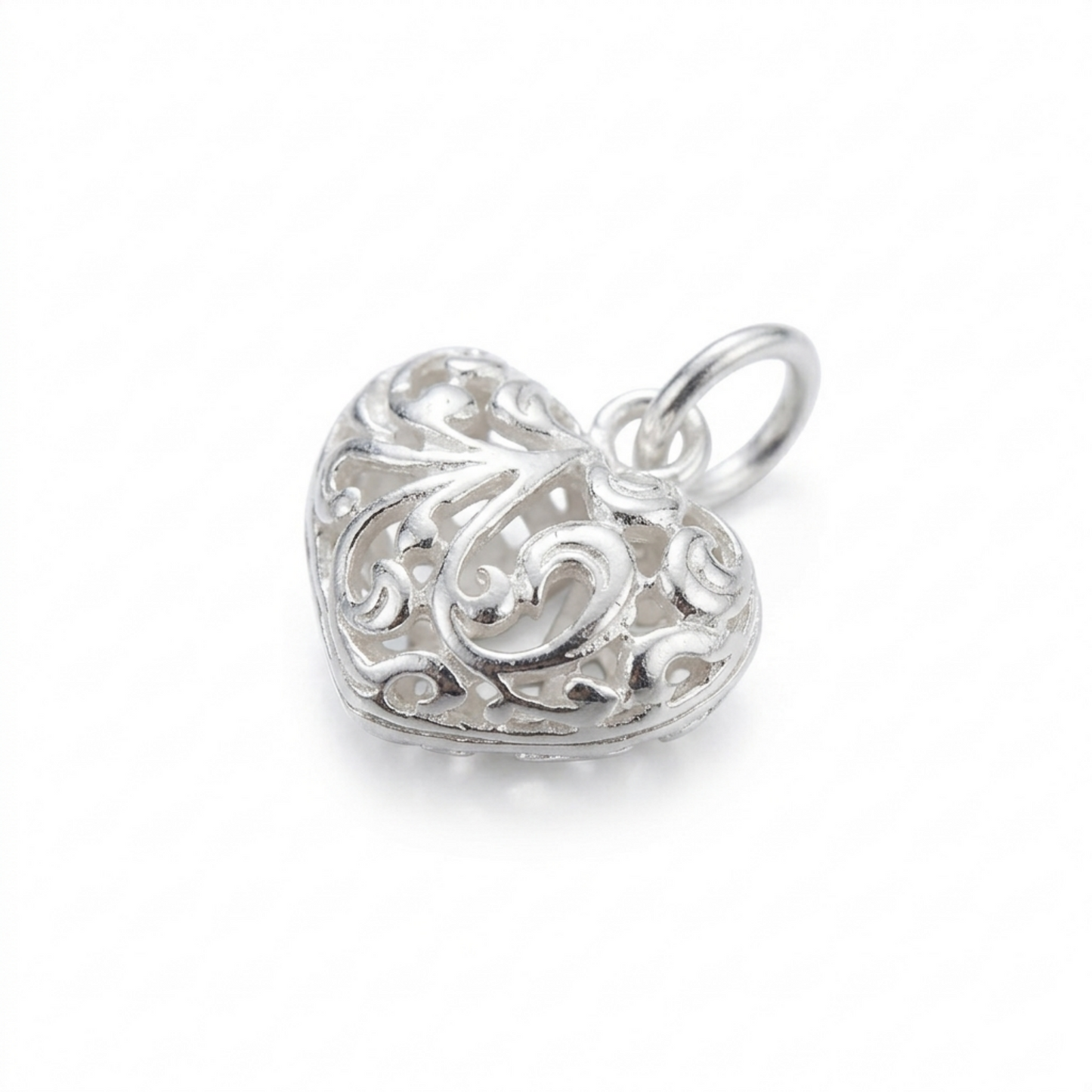 Silver-tone filigree floral puffy heart pendant, side view