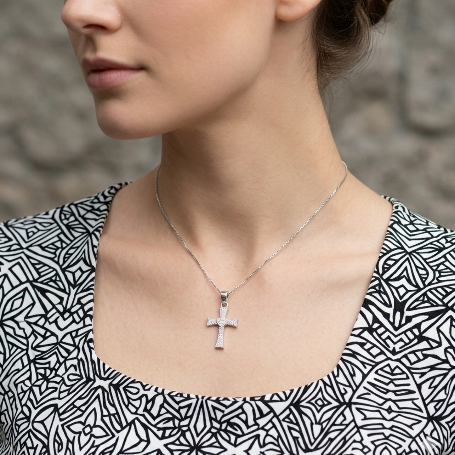 Heart cross CZ pendant worn on necklace, silver-tone cross with heart center