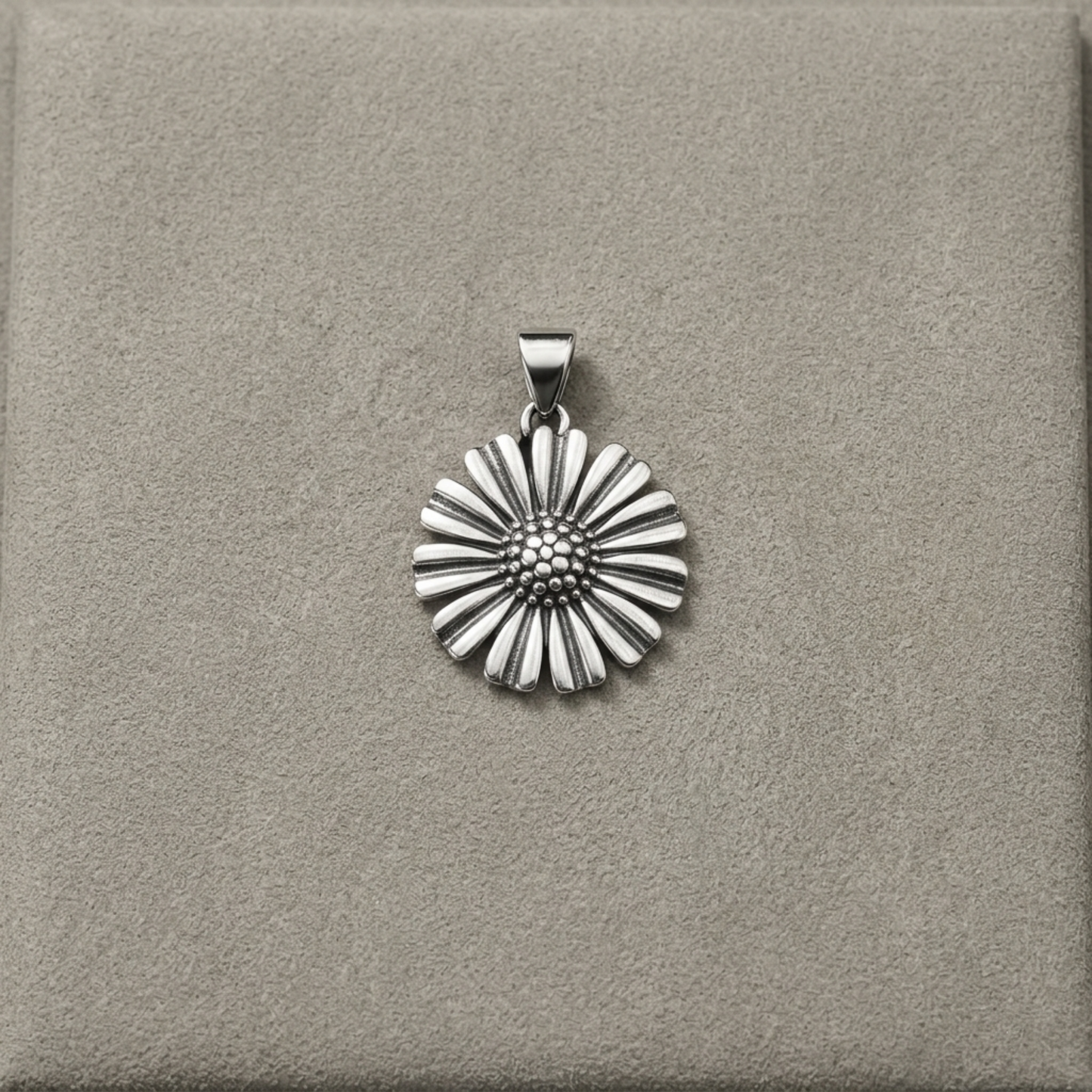 Silver-tone daisy pendant on bail, framed by scalloped petal design