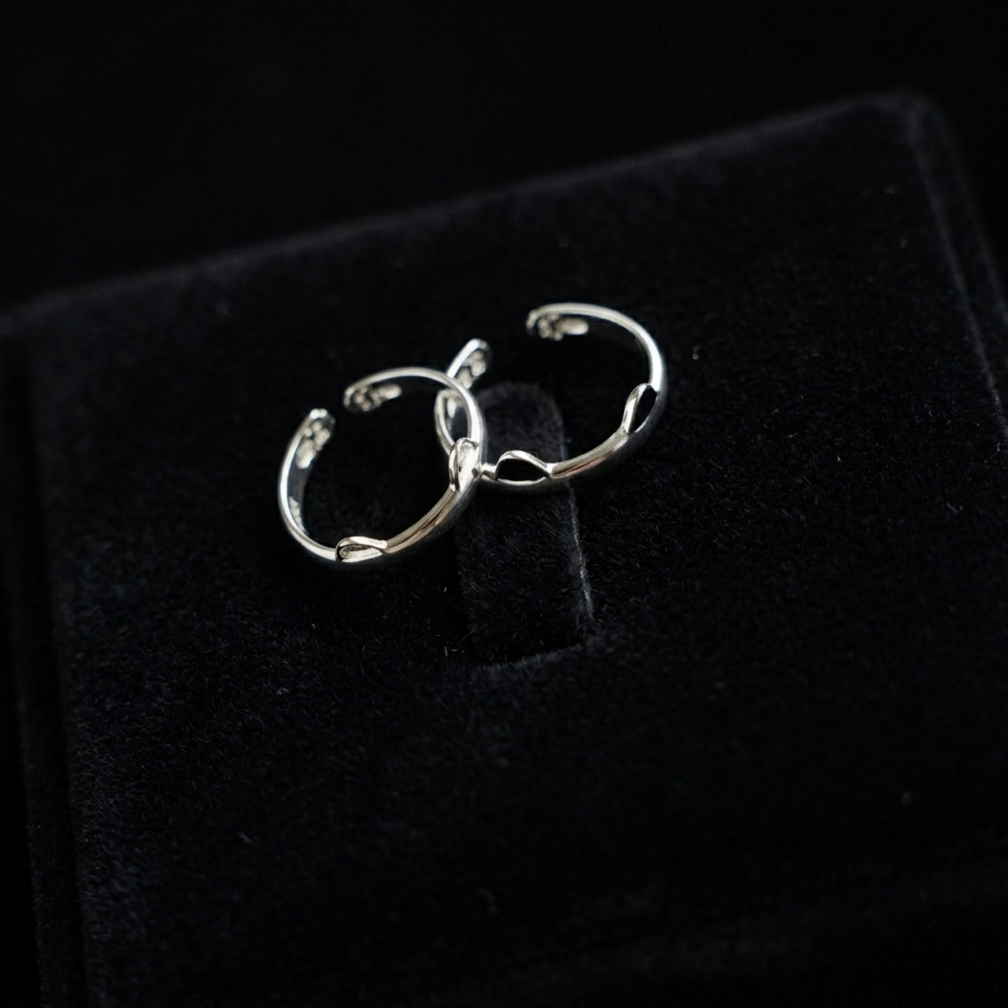 Silver-toned cat paw ring set with black enamel tips, small hoop style