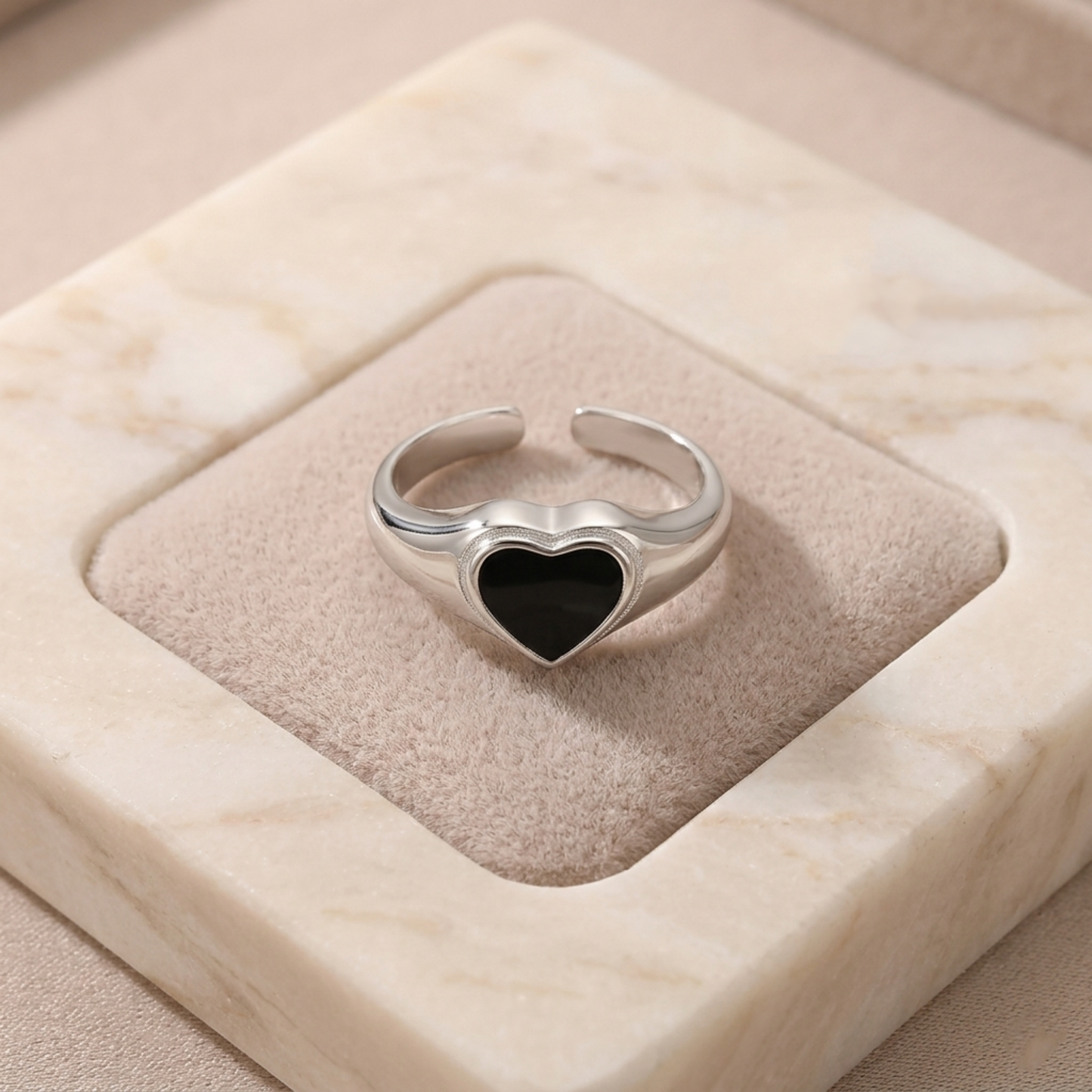 Wishbone heart ring with black enamel heart and silver edging