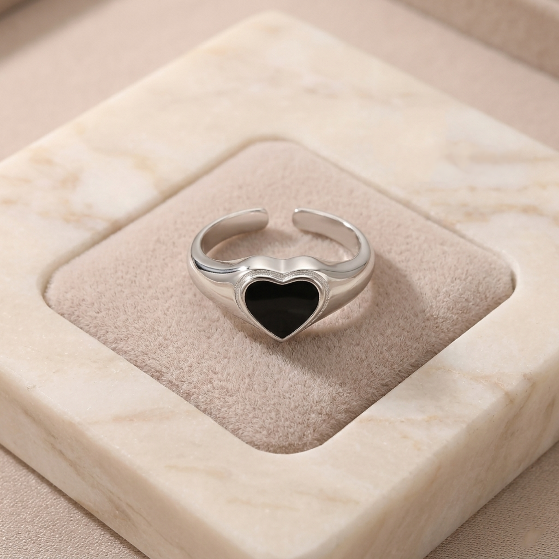 Wishbone heart ring with black enamel heart and silver edging