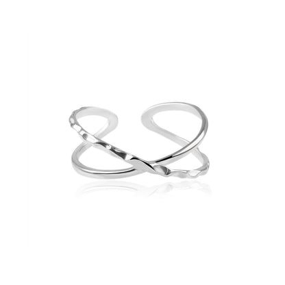Silver criss-cross knot ring, isolated on white background