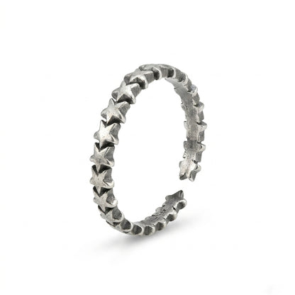 Oxidised linked stars ring, silver-toned band with raised star links