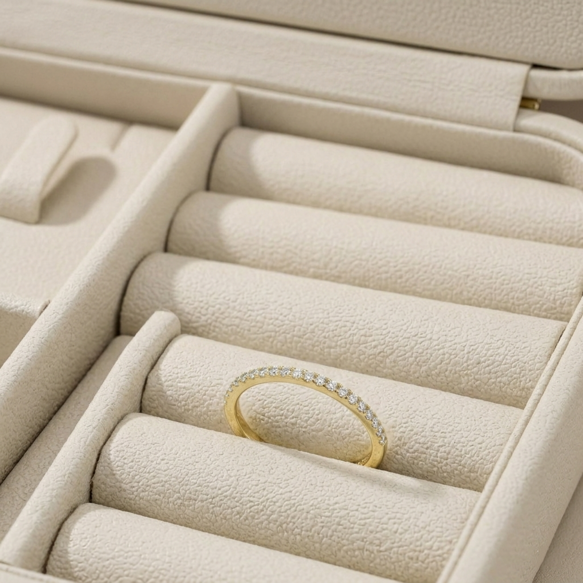 18K gold pavé stack ring in ring box, slim band with pavé stone row.
