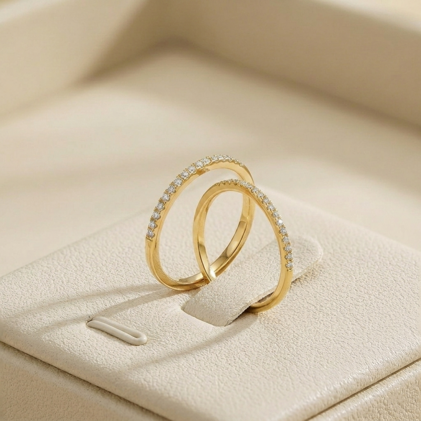 18K gold pavé stack ring with white pavé stones, two stacked slim bands.