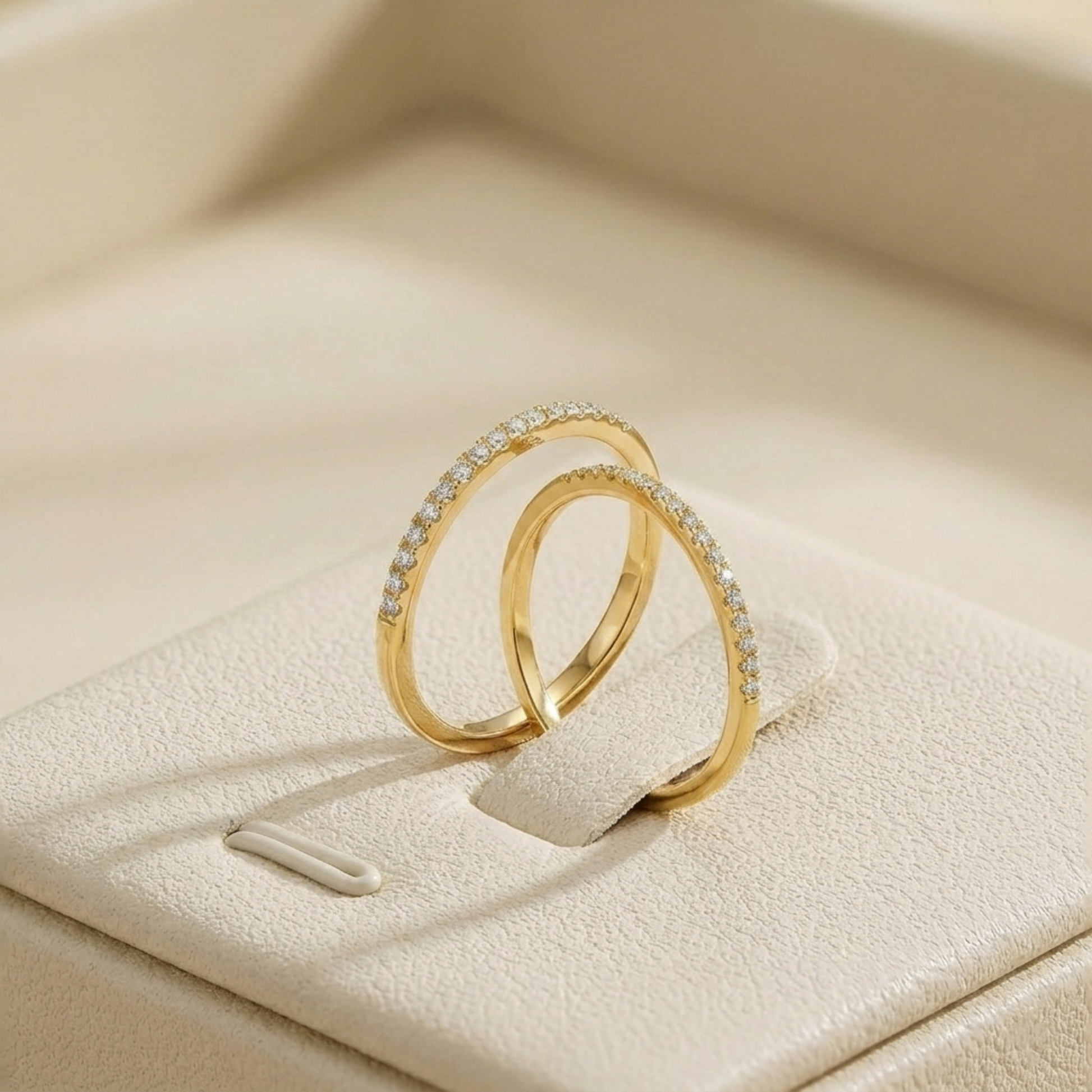 18K gold pavé stack ring with white pavé stones, two stacked slim bands.