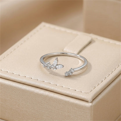 Silver CZ butterfly ring with two butterfly clusters on slim band