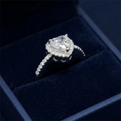 Heart Halo Ring close-up: round center stone in heart halo, pavé shank