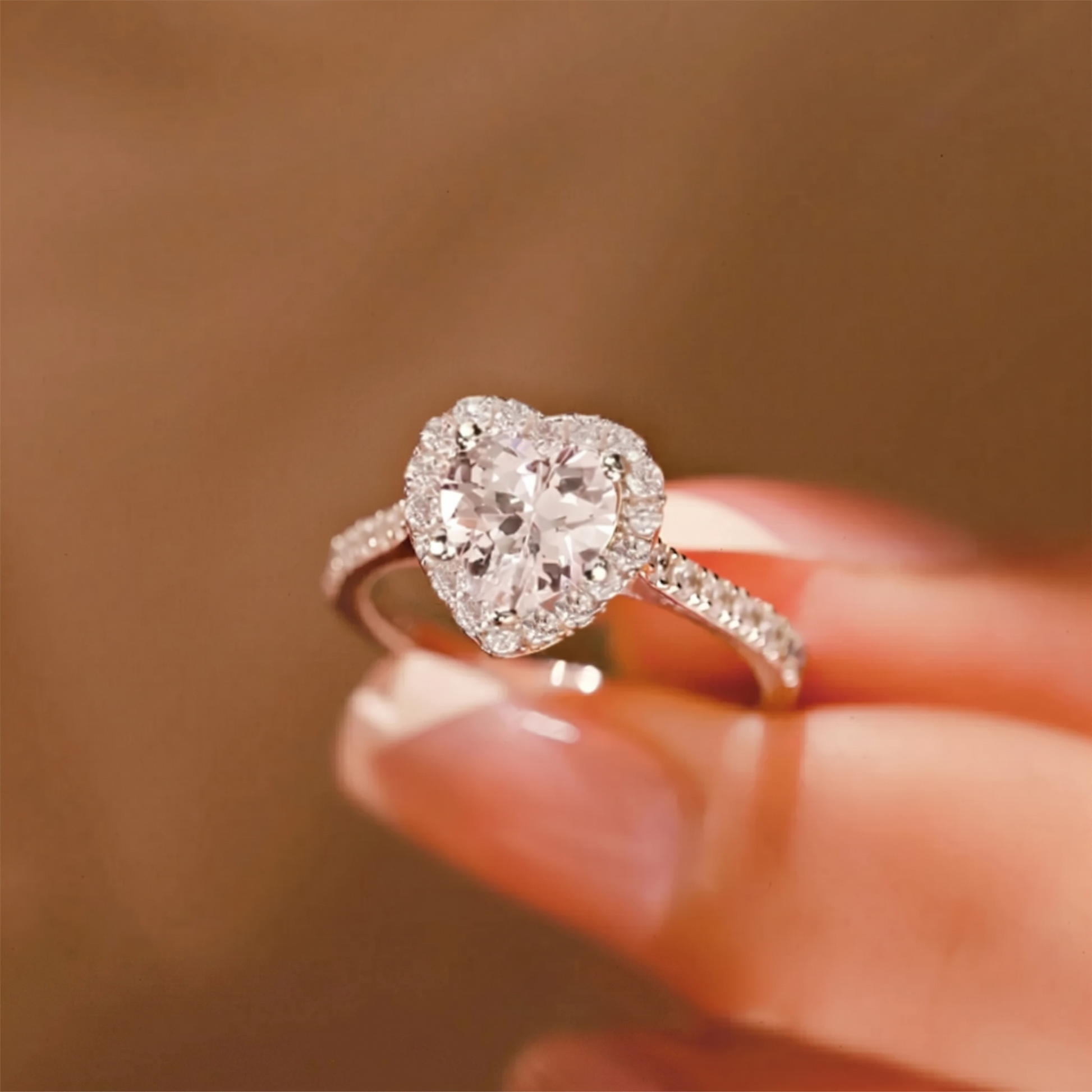 Heart Halo Ring on finger: heart-shaped halo with central stone and pavé band