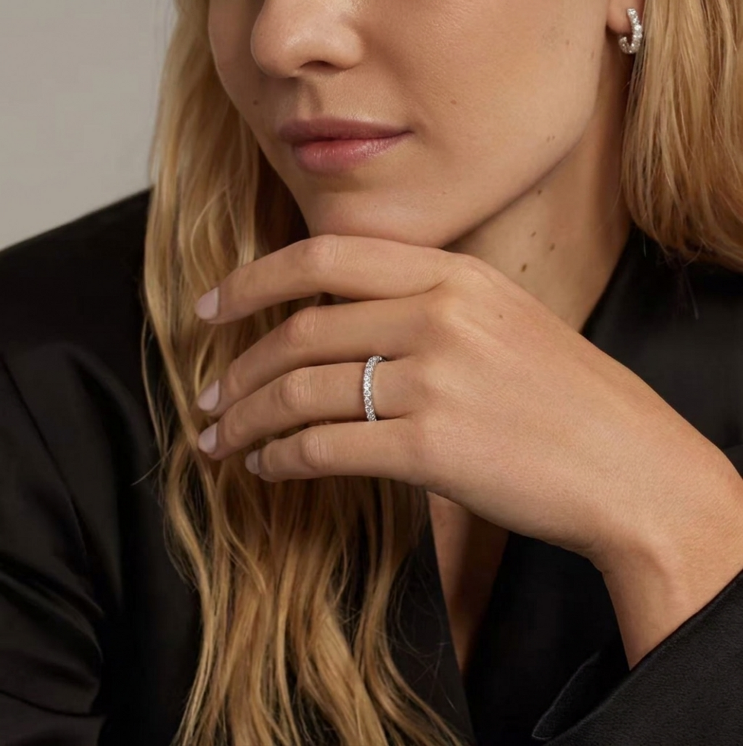 Rhodium CZ stacking eternity band on hand, pavé-set stones visible