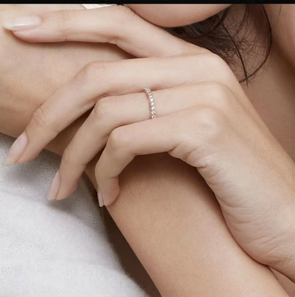 CZ Stacking Eternity Band in rhodium tone with sparkling stones, worn on finger