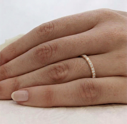 Rose gold CZ stacking eternity band on finger, continuous pavé stone row