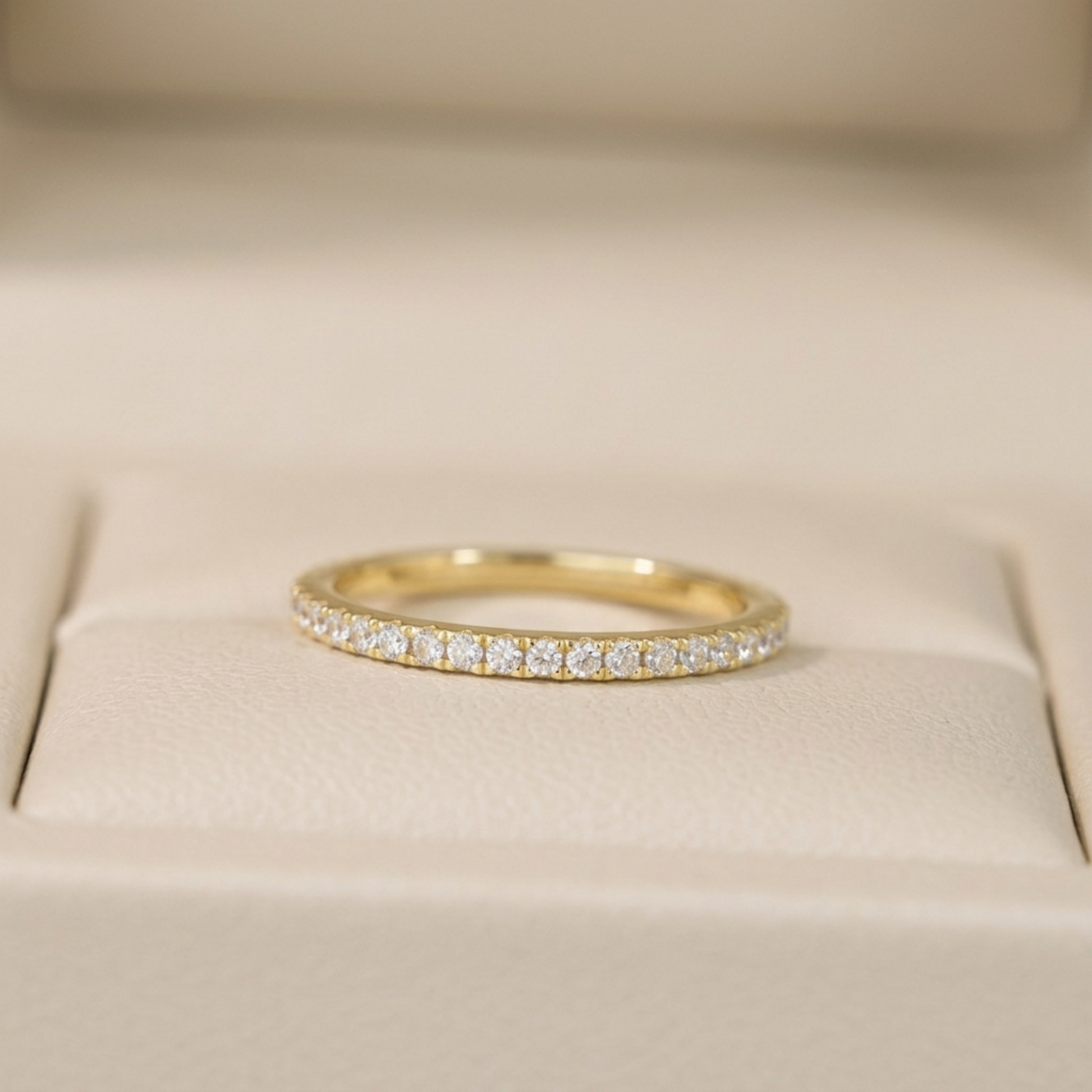 Gold CZ eternity band with pavé stones, smooth round top surface